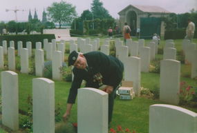 Len Butt Laying a wreath on the Grave of  Lt E.G.H. Phillips